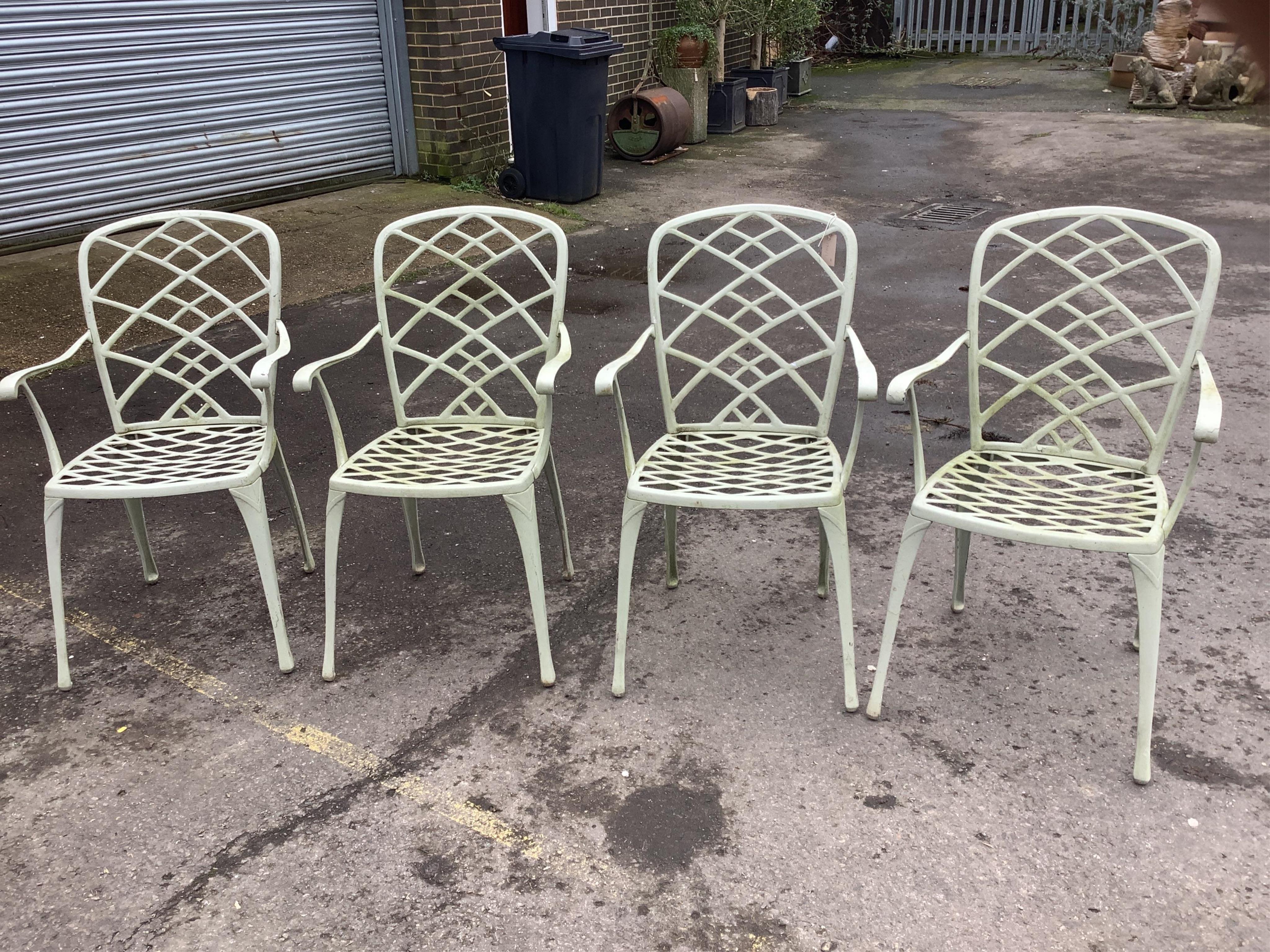 A set of four painted aluminium garden chairs, width 55cm, height 92cm. Condition - fair